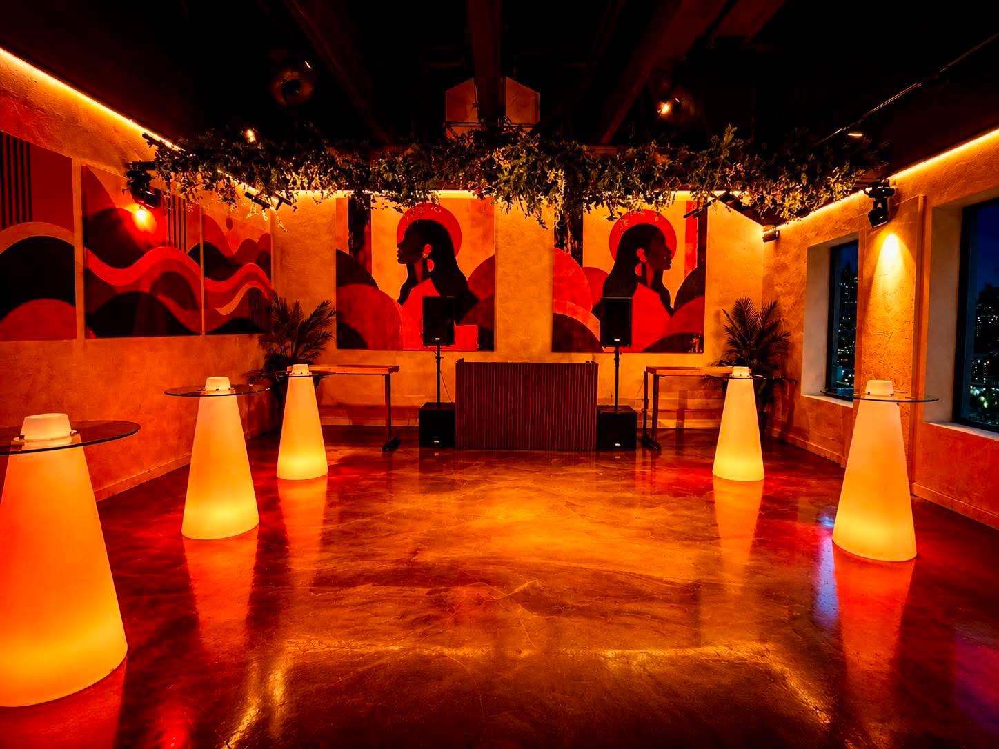 The room lit red with glowing cone tables