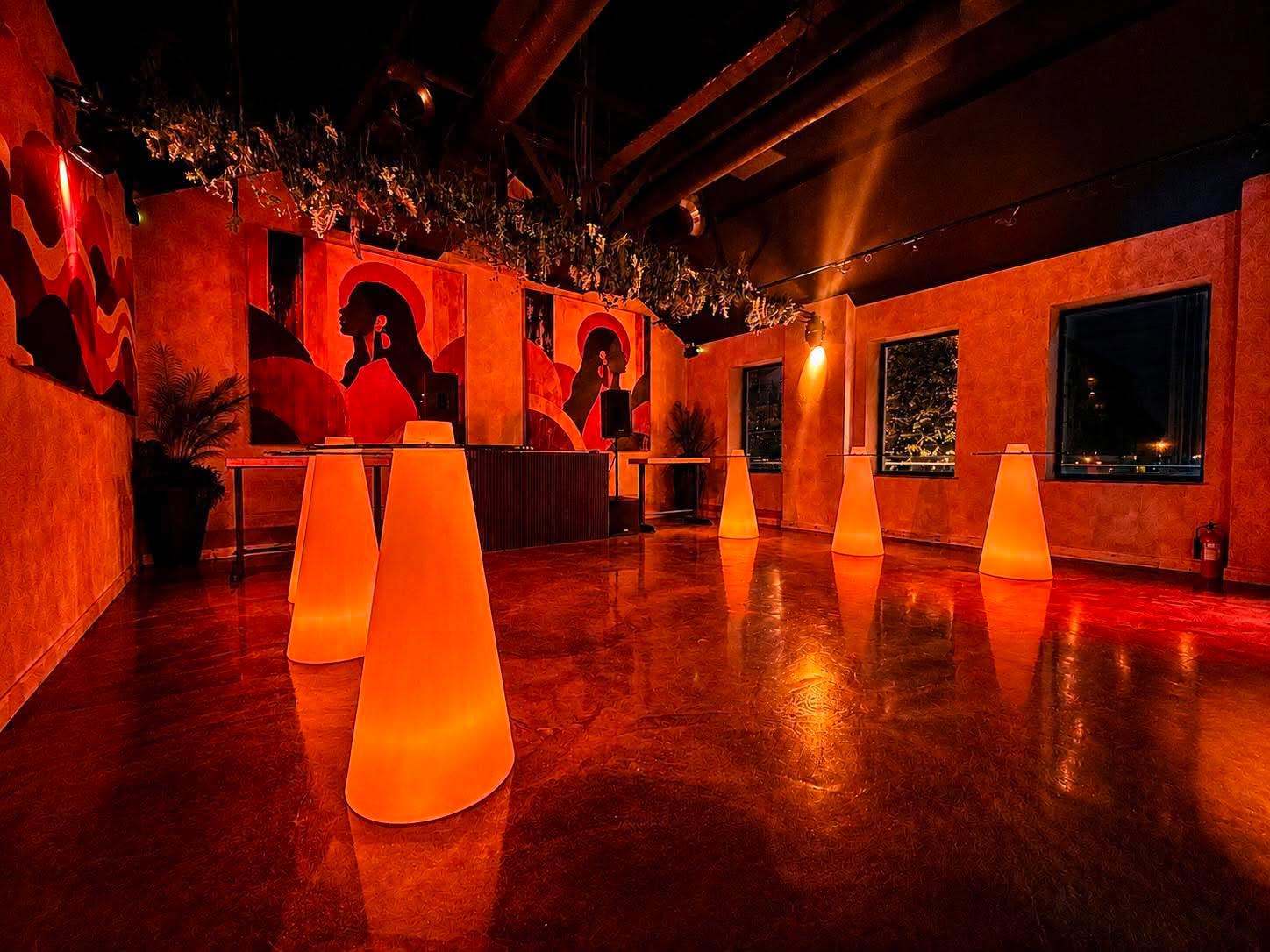 Glowing cone tables along the windows